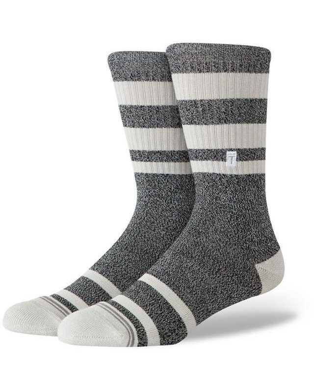 Sporting crew socks on foot
